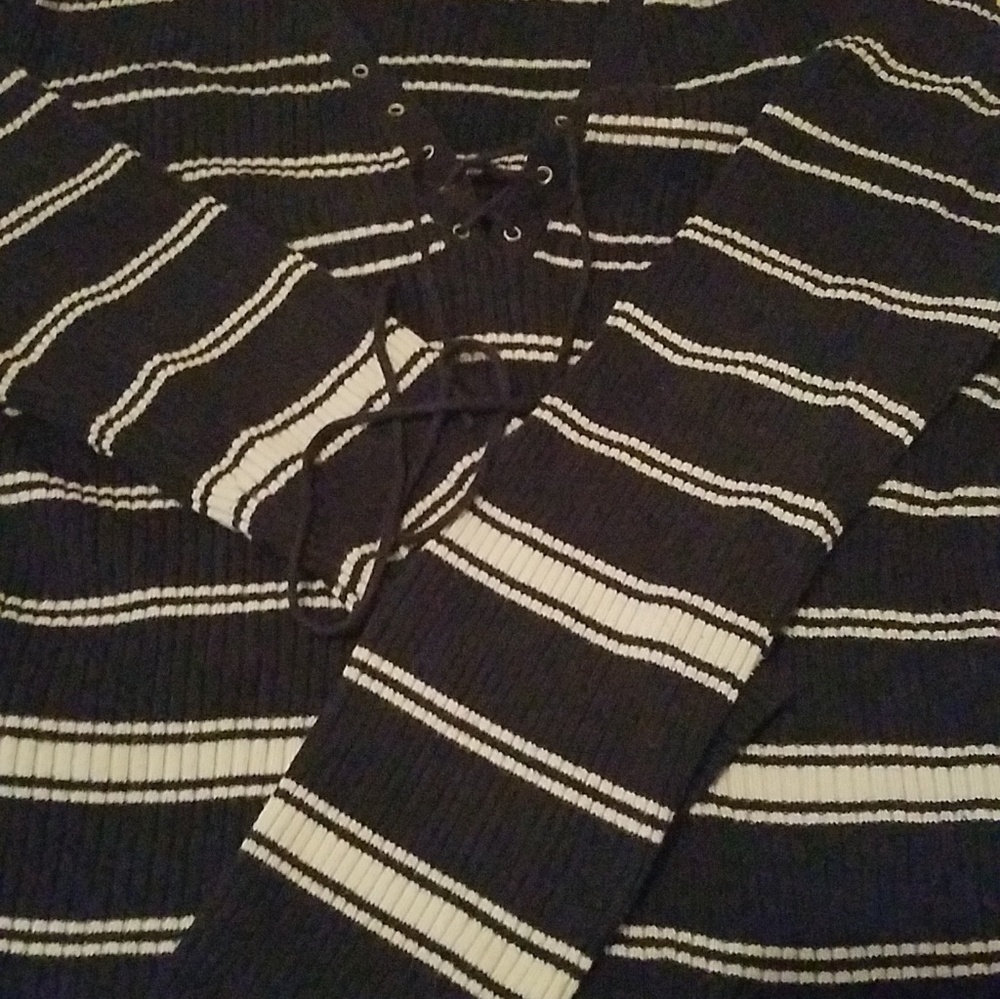 Long sleeve, navy blue and white striped sweater.